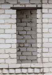 A window blocked with bricks in an old house