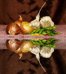 Still life Assorted fresh vegetables with water reflection Garlic Onion chilli