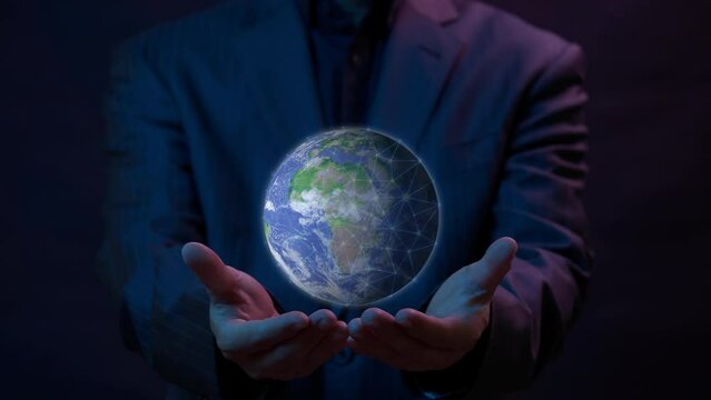 Businessman holding global network connection with icons in ESG environmental concept. Clean energy, renewable energy, Net Zero, Love the world, sustainable energy and reducing global warming.