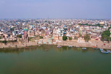 Drone Shot flying away from the coastline in India revealing the entire city of Varanasi and varanasi ghat in banaras