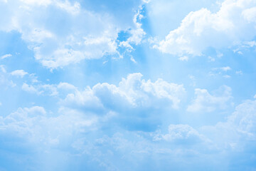 Radiant Summer Day Blue sky adorned with fluffy white clouds, creating a beautiful and clear...