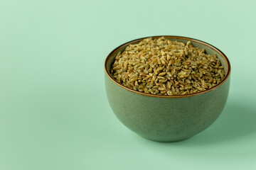 Uncooked freekeh in a bowl.  The cereal is made from immature, green, fire-roasted wheat.