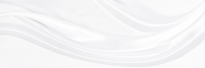 White gray satin texture that is white silver fabric silk panorama background with beautiful soft blur pattern natural.