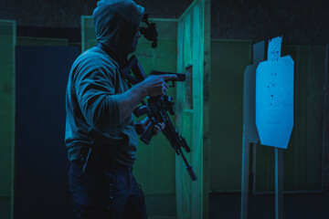 Tactical shooting training with night vision at a shooting range.