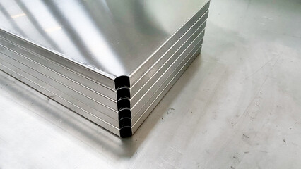 Metal stainless sheet bending on hydraulic machine.  bending stainless sheet. - obrazy, fototapety, plakaty