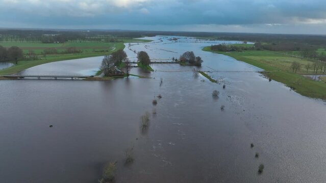 High water level in the river Vecht at the Vechterweerd weir near Dalfsen in Overijssel. The river is overflowing on the floodplains after heavy rainfall upstream.