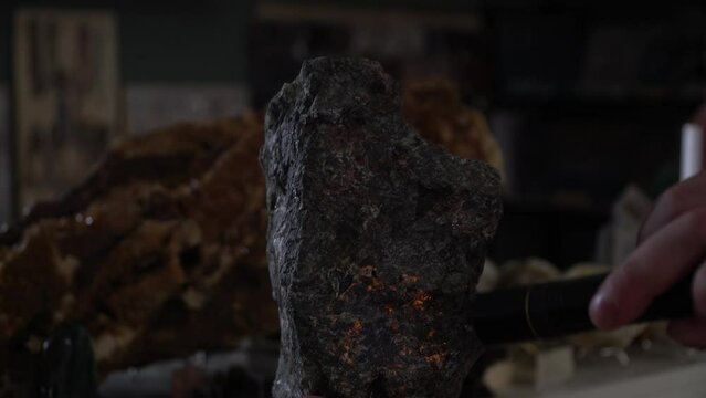 glowing stone. Opal. The stone glows under ultraviolet light. Geology. Geologic findings. Excavation. Rare stone. Rock.