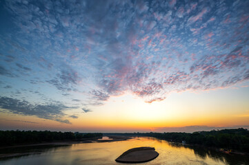 Beautiful sunrise over the Guaviare River in Colombia - 748099339