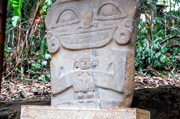 Ancient statue holding a baby in San Agustin, Colombia - 748100502