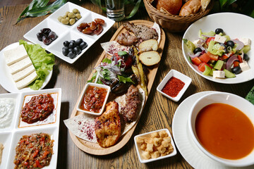 Wooden Table With Platters of Food