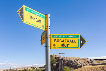 Fototapeta premium Road sign at Bogazkale near ruins of ancient city of Hattusa. Corum, Turkey (Turkiye)