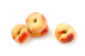 Several saturn peaches or flat peaches isolated on white background with clipping path..