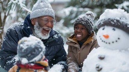 A senior man laughs joyfully while building a snowman with his grandchildren in the backyard
