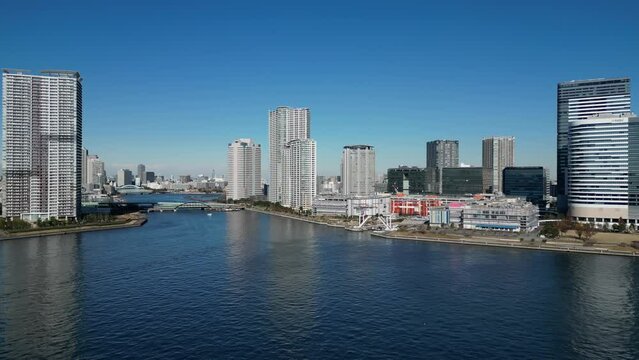 Aerial video of roads and bridges in Tokyo city on a sunny day, Japan