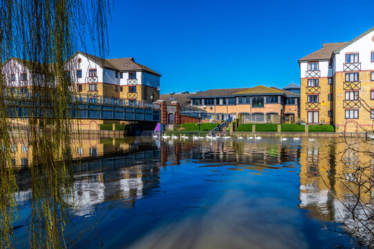 A view across the River Nene in the centre of Peterborough, UK on a bright sunny day