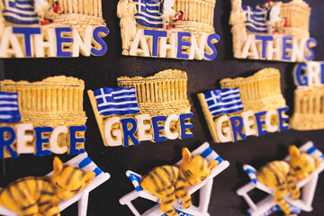Traditional tourist souvenirs and gifts from Greece, fridge magnets with text 
