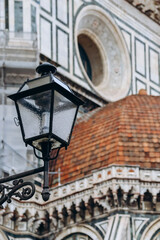 Lantern in front of Cathedral of Santa Maria del Fiore (Saint Mary of the Flower) in Florence, Italy.