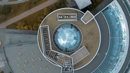 Top view of modern round building with dome. Stock footage. Beautiful architecture of business...