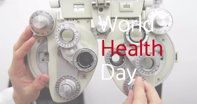 Animation of world health day text over caucasian male optometrist adjusting equipment