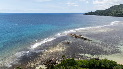 panoramic drone view of the coast of the Seychelles with bays and white catamarans