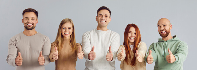 Thumb up friends gesture of approval, encouragement, young people group raising thumb showing...
