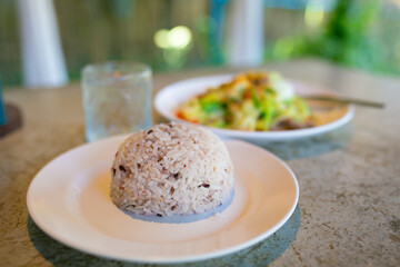 rice with meat and vegetables on a table in a restaurant, stock photo