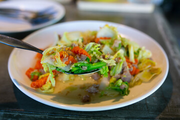 rice with meat and vegetables on a table in a restaurant, stock photo