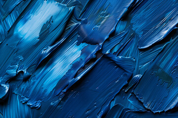 Detailed close-up view of a textured blue paint surface, showcasing intricate brush strokes and varying shades of blue.