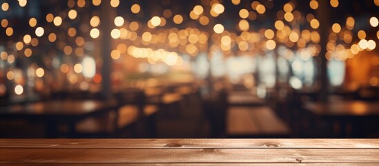 A wooden table is prominently featured in the foreground of the image, with a background consisting of abstract, blurry lights from a restaurant setting.