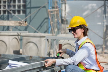 Foreman builder woman at construction site. Foreman construction woman working at construction site