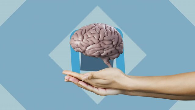 Animation of spinning brain over crosses and hand