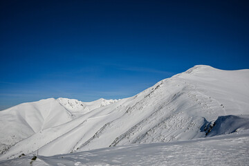 winter hiking to the top in the western Tatras Baranec, beautiful winter weather and lots of snow