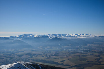beautiful view from Mount Baranec in the Western Tatras to the Low Tatras (Chopok) Winter weather, lots of snow