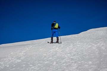 Naklejka na ściany i meble ski alpinist climbs to the top of Baranec in the Western Tatras