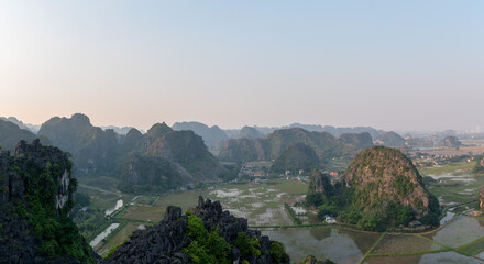 Sunset Views of of Dam sen Hang Mua in Northern Vietnam Overlooking the Ninh Binh Region of rice fields.  © Chris