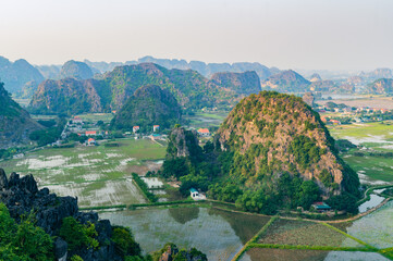 Sunset Views of of Dam sen Hang Mua in Northern Vietnam Overlooking the Ninh Binh Region of rice...