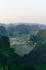 Viewpoint Đầm sen Hang múa is a popular spot for tourists visiting Tam Coc in the Ninh Binh region of Vietnam. In the background are the mountains and rice fields of the region. © Chris