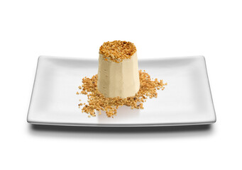 Semifreddo dessert of pistachio ice cream with sprinkles on a rectangular white plate - isolated