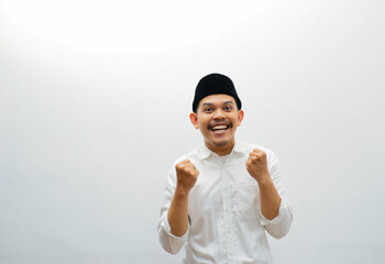 asian muslim man clenched fist happy expression