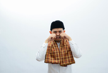 asian muslim man showing sad expression