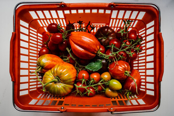 A Vibrant Red Basket Brimming with Fresh Tomatoes