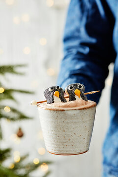 Cup of cocoa with penguin marshmallows