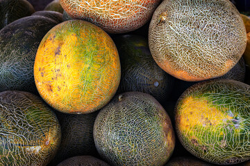 ripe melon fruits piled up in close-up