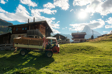 Peaceful farming village on hill with truck and matterhorn mountain in rural scene at Switzerland