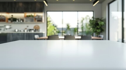 A modern empty white marble table is used for product display against the backdrop of a kitchen room interior.
