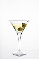 Martini glass with olive.