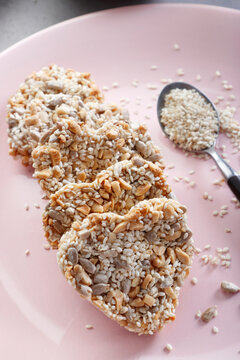 Cookies with sesame and sunflower seeds in the shape of a heart