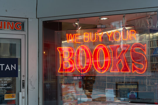 neon sign in window at BMV Books located at 2289 Yonge Street north of Eglinton Avenue West in Toronto, Canada