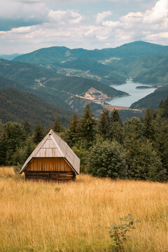 Cottage surrounded by forest high in the mountain with view on the lake, Zaovine, Tara, Serbia © Brue