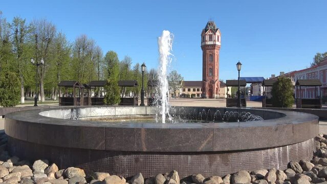 Fountain on the background of a water tower. Staraya Russa, Novgorod region